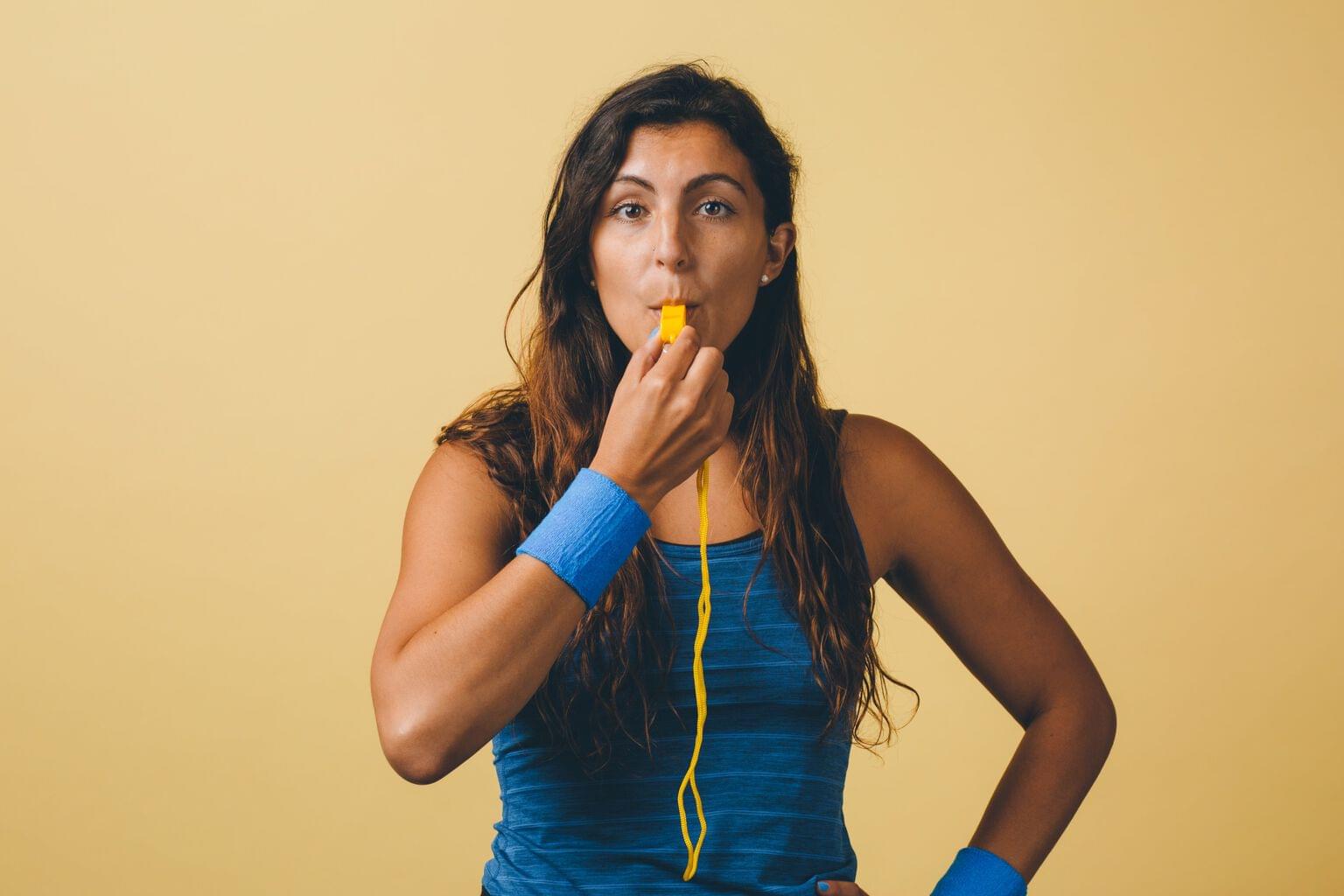 Train and support your agents, person with whistle in month