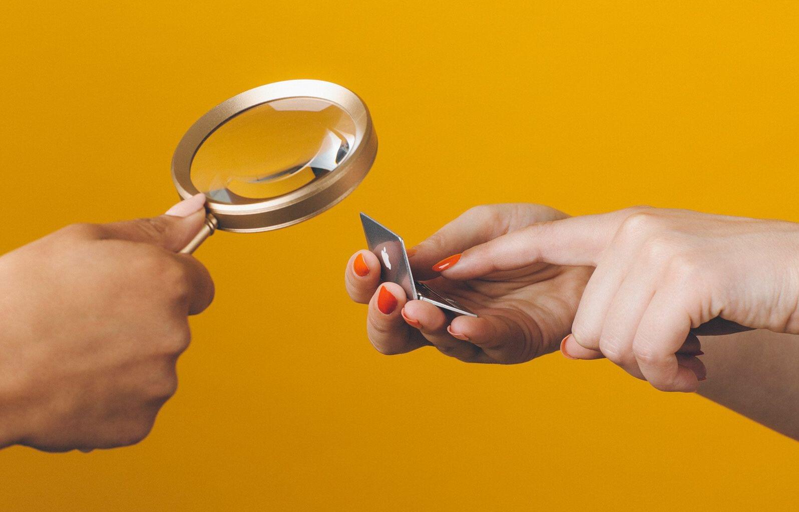 Sales technology, magnifying glass over laptop