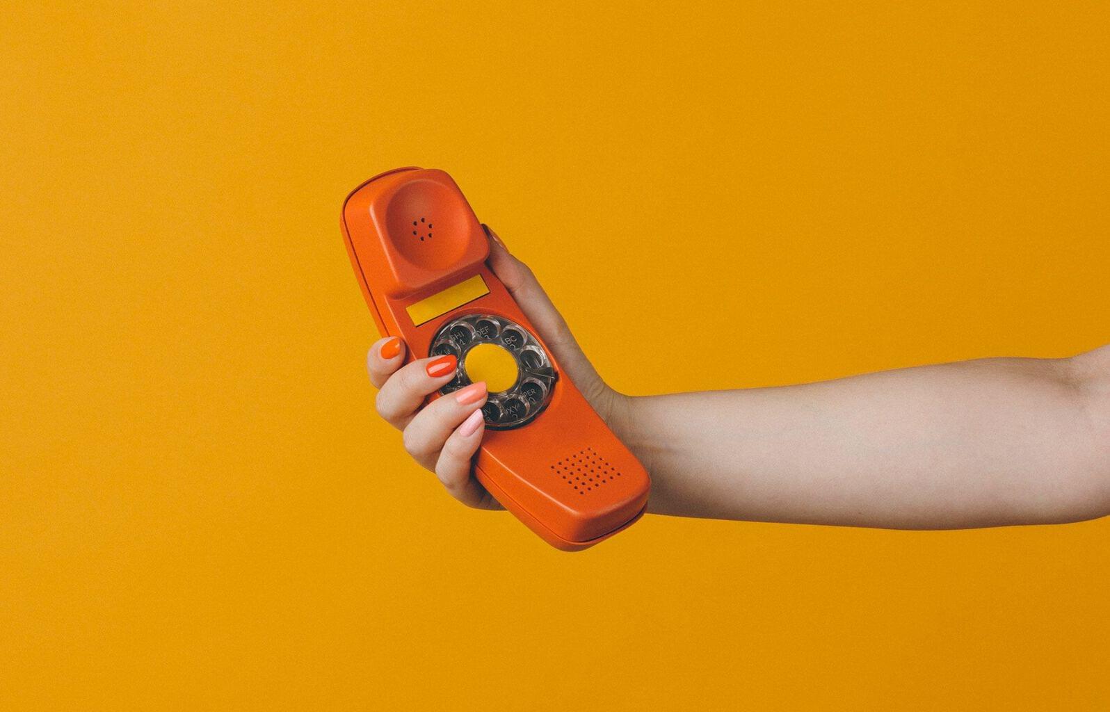 A call to action, hand holding a phone