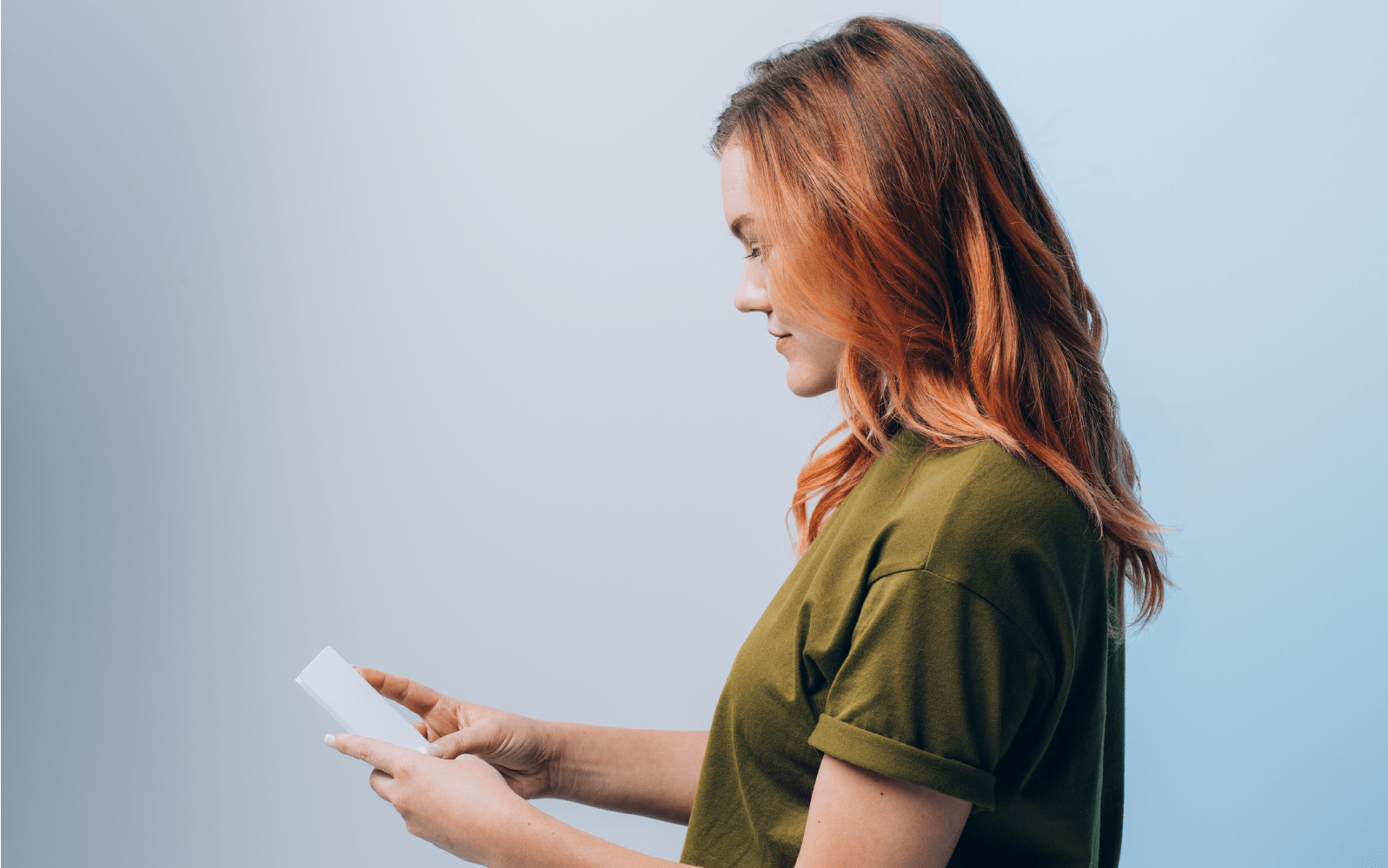 A sales representative using mobile CRM on her phone.